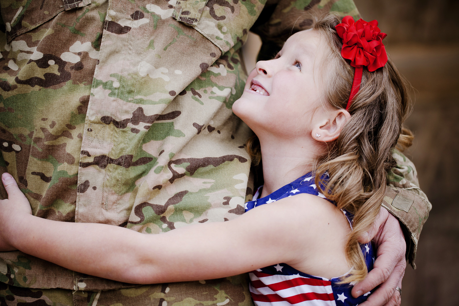 Girl Hugging Soldier